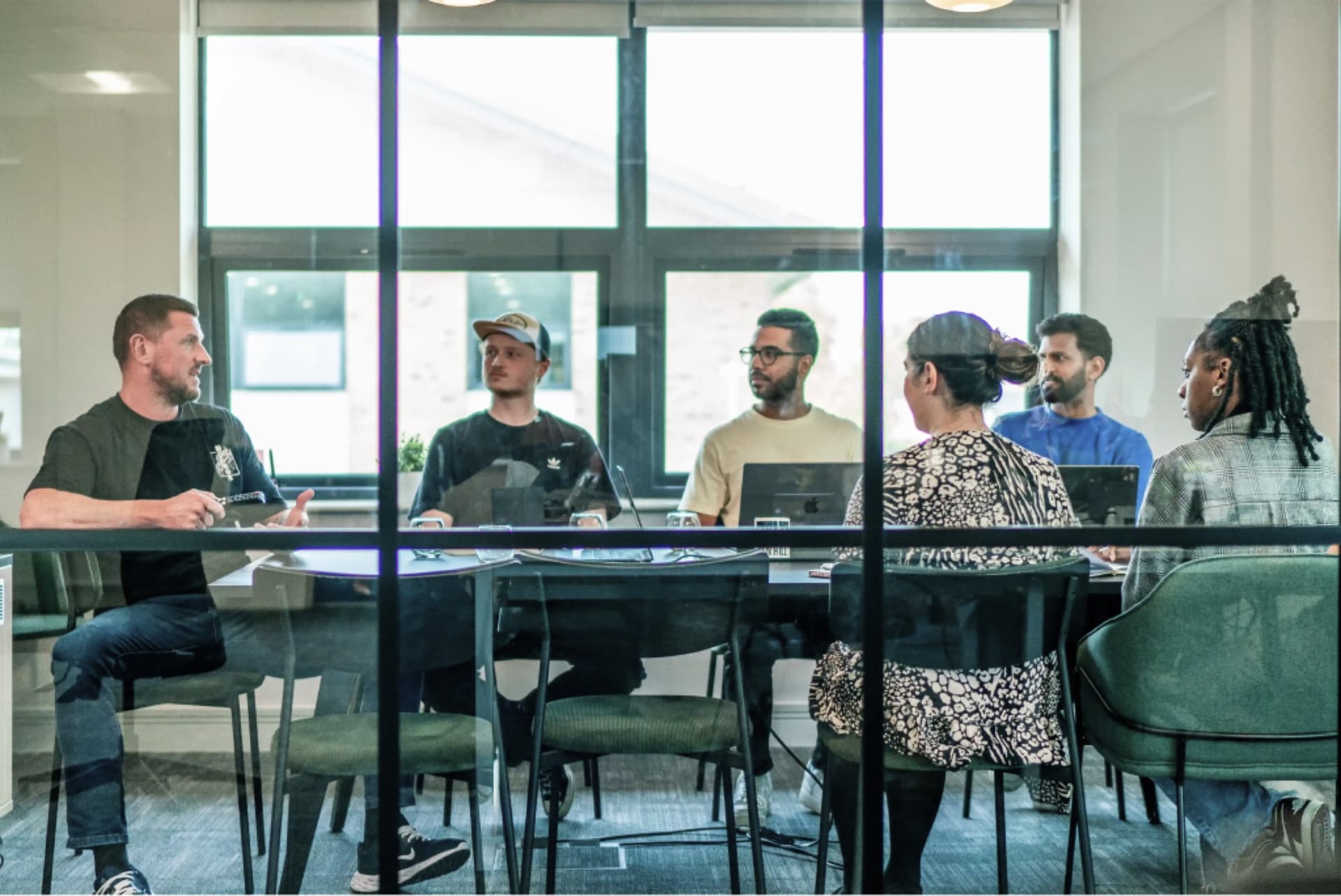 The Pixel team in a meeting around the boardroom table